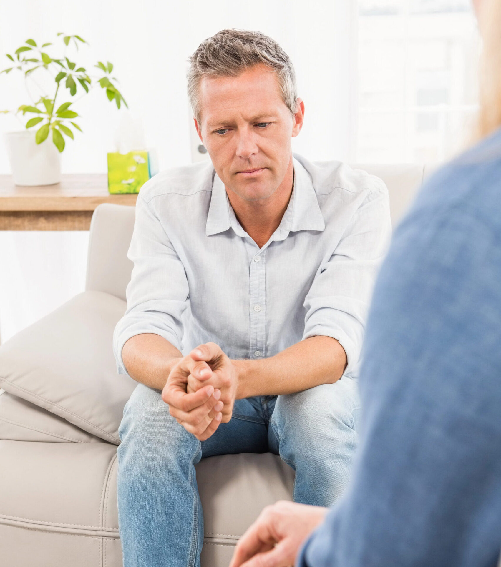 Man at therapy on couch